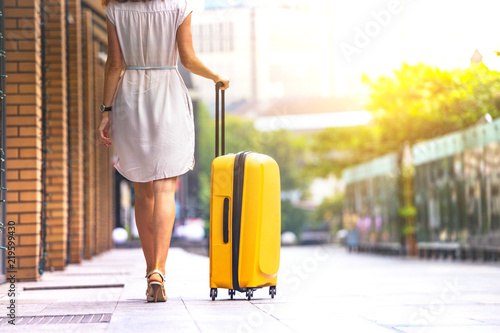 Girl traveler and suitcase