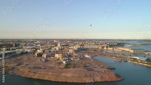 Harbor cityscape, Aerial sideway view of jatkasaari island, on a sunny summer evening, in Helsinki, Uusimaa, Finland photo