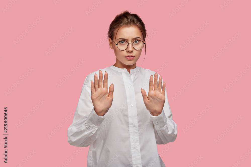 People, refusal, abstention concept. Pretty female in round spectacles