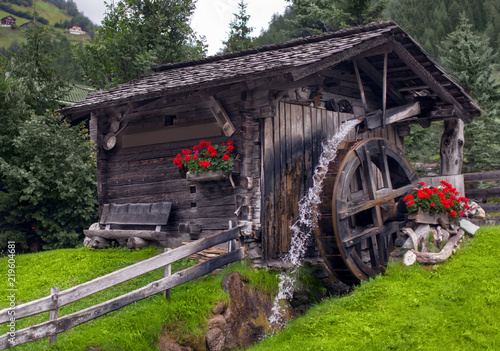 Water mill in a picturesque place among the forest
