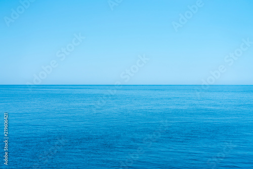 Sea and the cloudless blue sky  flowing into the horizon