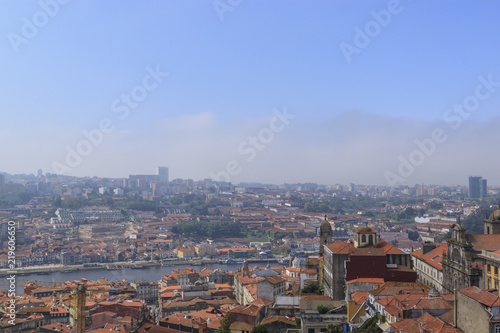 Scenic view of Porto, Portugal from the tower Clérigos Church. River Douro. Orange roofs of the houses.