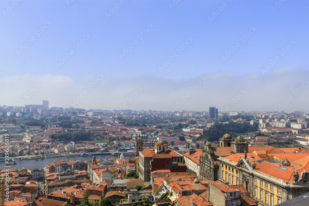 Scenic view of Porto, Portugal from the tower Clérigos Church. River Douro. Orange roofs of the houses.
