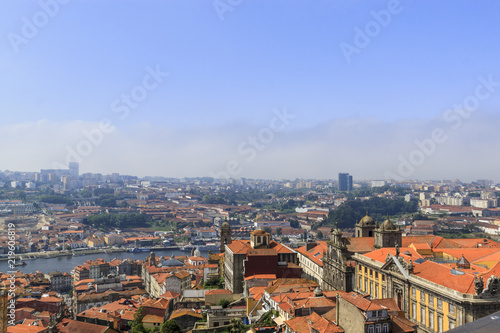 Scenic view of Porto, Portugal from the tower Clérigos Church. River Douro. Orange roofs of the houses.