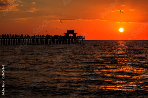 Beautiful sunset along the Naples Beach Pier in Naples  Florida.