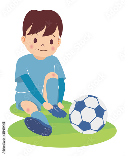 サッカー少年_スパイクを履く