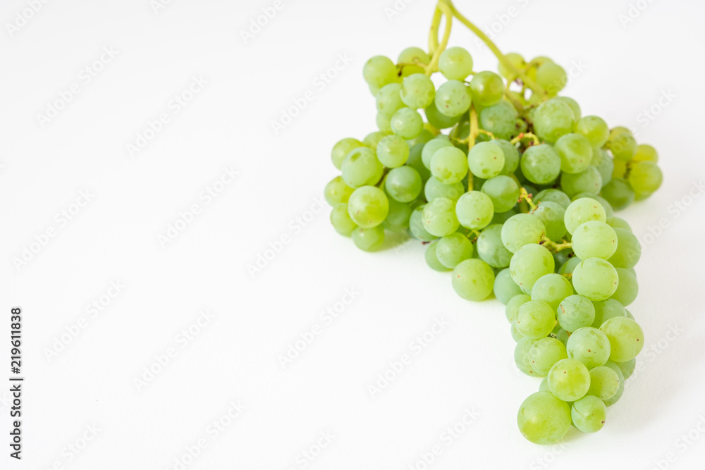 Bunch of fresh picked champagne grapes on a white background
Bunch of fresh picked champagne grapes on a white background