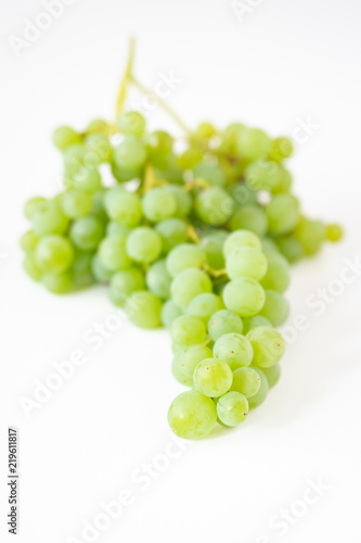 Bunch of fresh picked champagne grapes on a white background 
