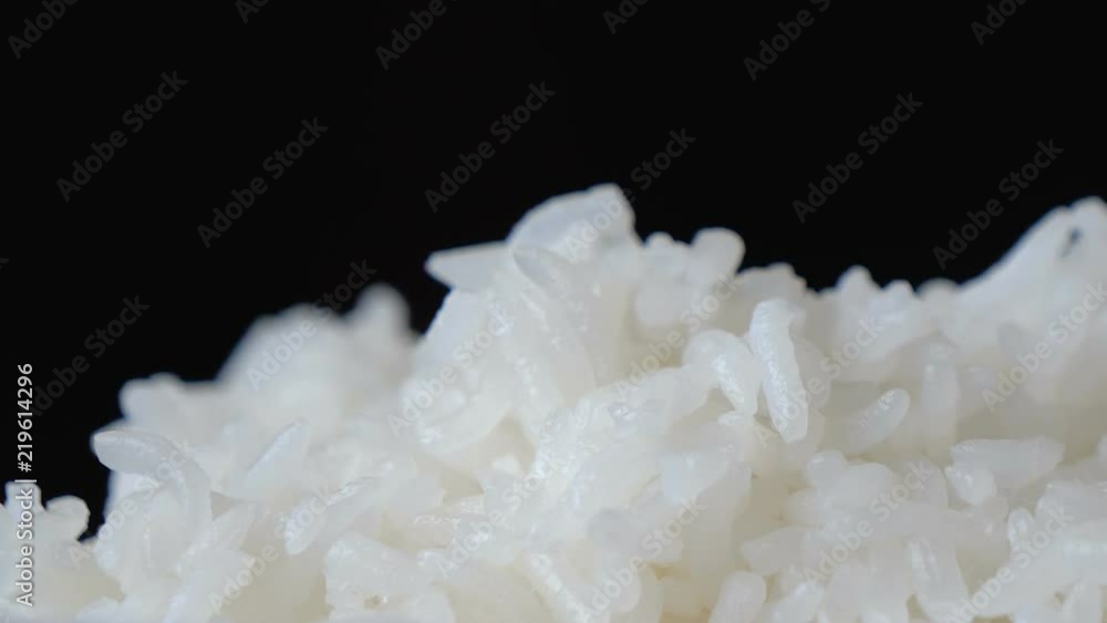 Motion video of close up steaming white rice. Motion video of close up steaming white rice.