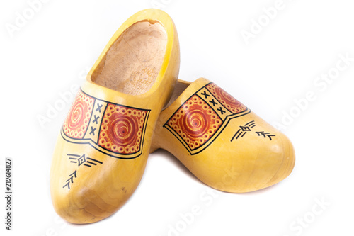 Wooden shoes typical for traditional rural wear in The Netherlands shot in the studio on a white background