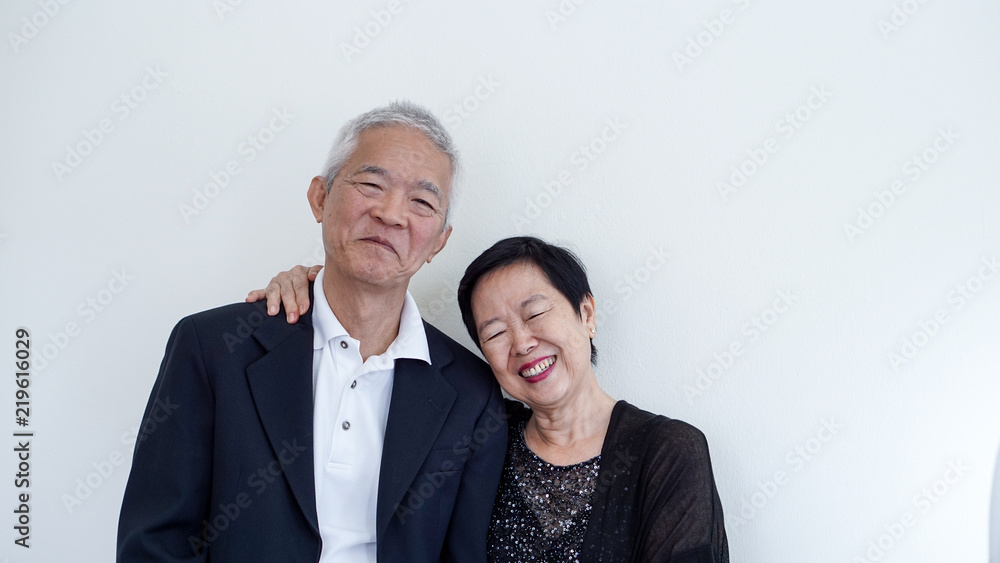 Happy smile Asian elderly couple in business attire, SME owner Happy smile Asian elderly couple in business attire, SME owner