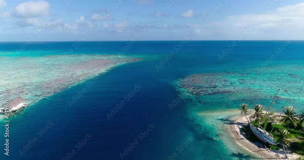 small islands (motu) in the middle of a lagoon in aerial view, French Polynesia small islands (motu) in the middle of a lagoon in aerial view, French Polynesia