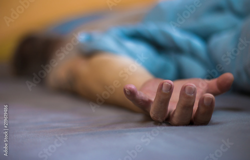 an elderly man lies asleep in a bed

