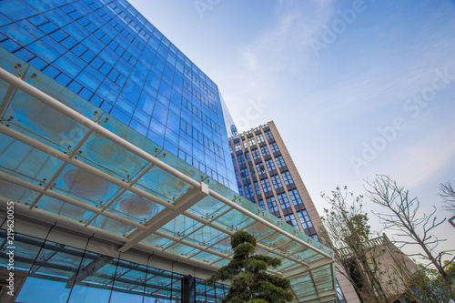 Modern corporate office building, huge glass window wall