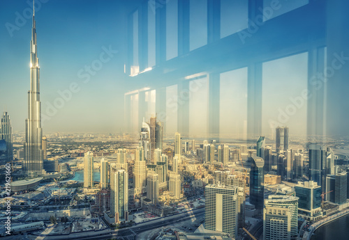 Elevated view on downtown Dubai, UAE. Skyscrapers of the business bay. Scenic travel background.