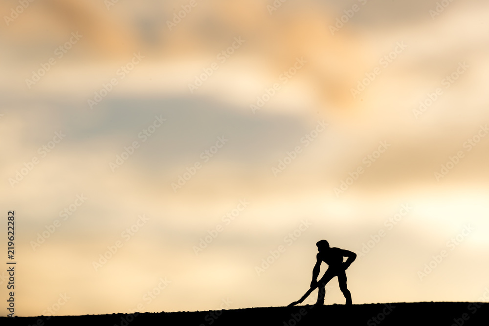 Abstract,silhouette Model people mining on sky sunset background.