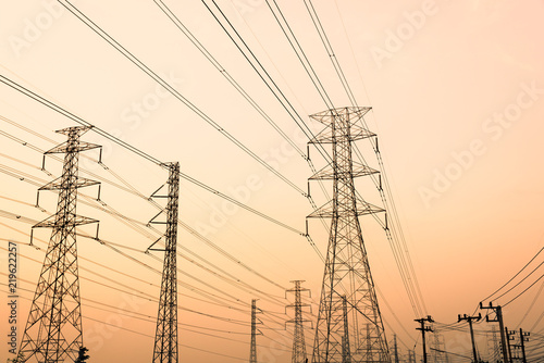 silhouette high voltage pole on sky sunset background.