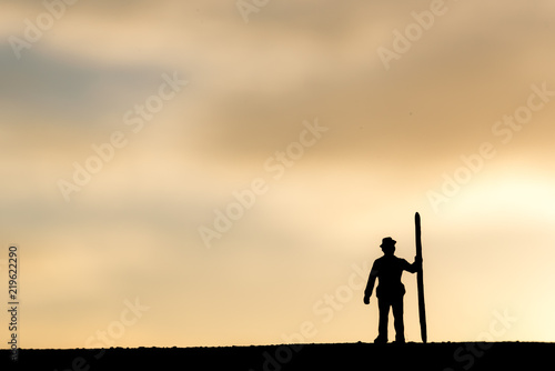 Abstract,silhouette Model people mining on sky sunset background. © pinglabel