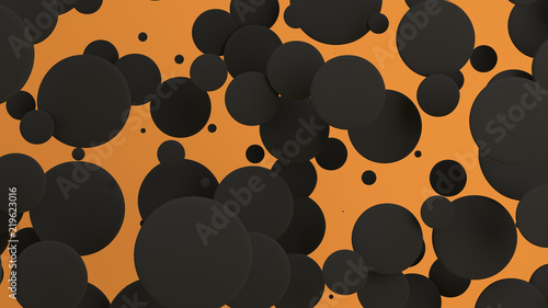 Black discs of random size on orange background