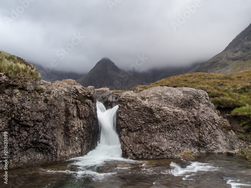 2-way waterfall from rocks in mountains