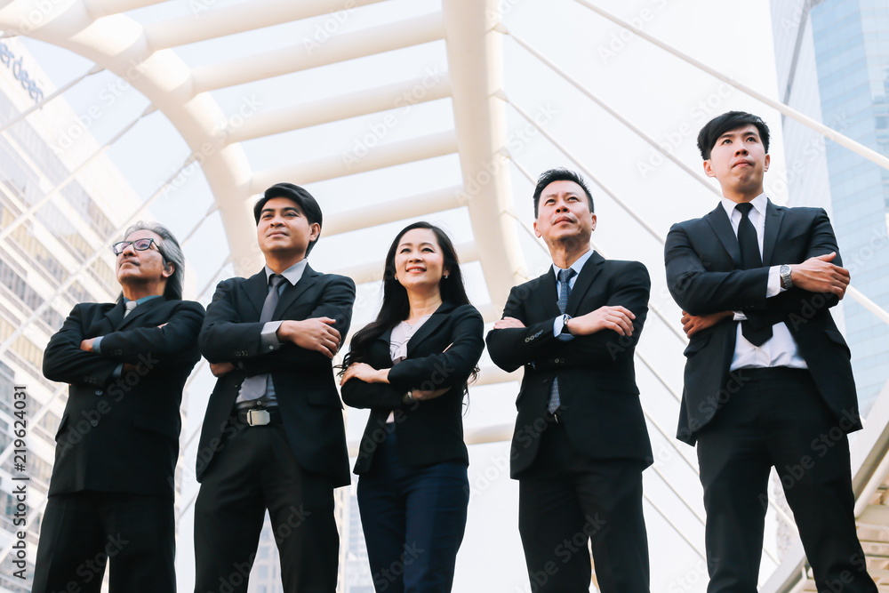 Successful business people are looking with a beautiful smile in front of them. Successful business people are looking with a beautiful smile in front of them.