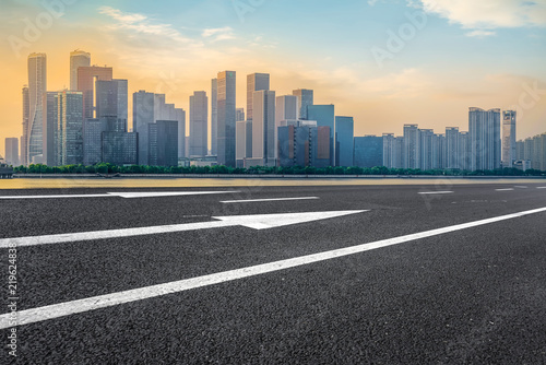 Urban road asphalt pavement and skyline of Hangzhou architectural landscape