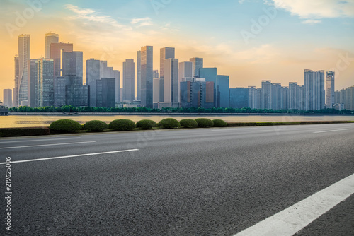 Urban road asphalt pavement and skyline of Hangzhou architectural landscape