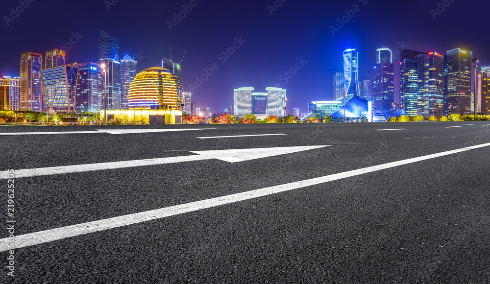 Urban road asphalt pavement and skyline of Hangzhou architectural landscape