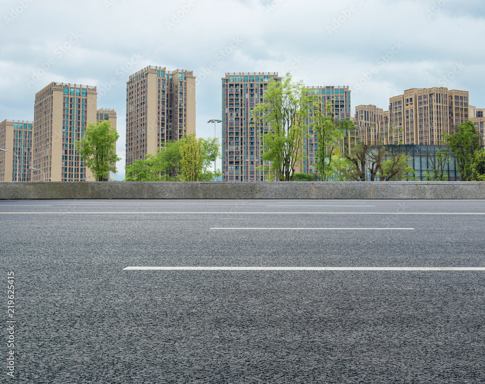 Modern city high-rise and asphalt highway Modern city high-rise and asphalt highway