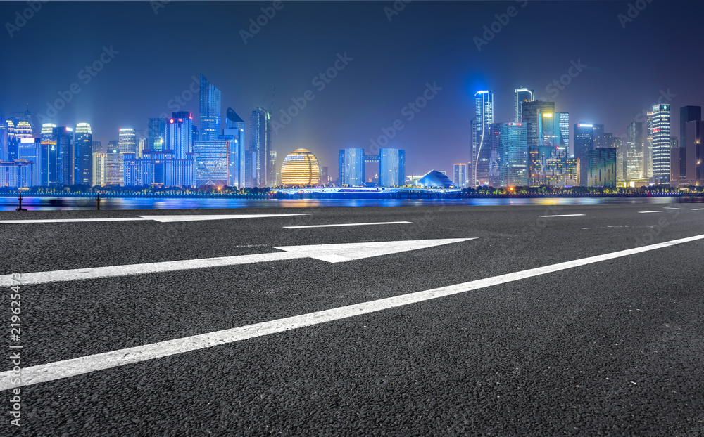Urban road asphalt pavement and skyline of Hangzhou architectural landscape
