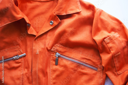 An orange jumpsuit of a prisoner. Prison clothes, jumpsuit sentenced to correctional labor,community payback