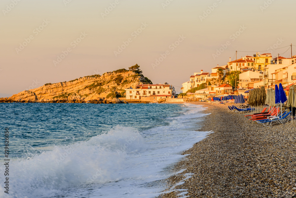 Kokkari beach is a picturesque beach in Kokkari village, beautiful sunset view, Samos island, Greece
