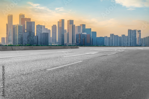 Urban road asphalt pavement and skyline of Hangzhou architectural landscape