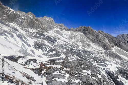 Looking up at the majestic and snowy mountain top, in Yulong Snow Mountain, Lijiang City, Yunnan Province, China