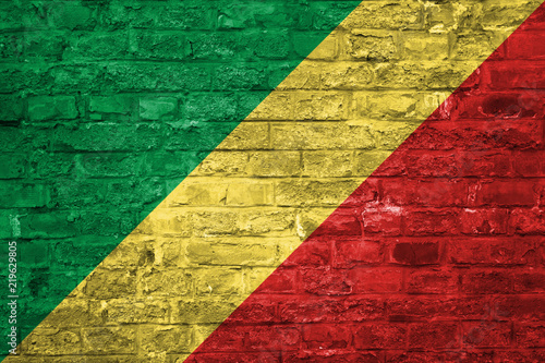 Flag of Republic of Congo over an old brick wall background, surface