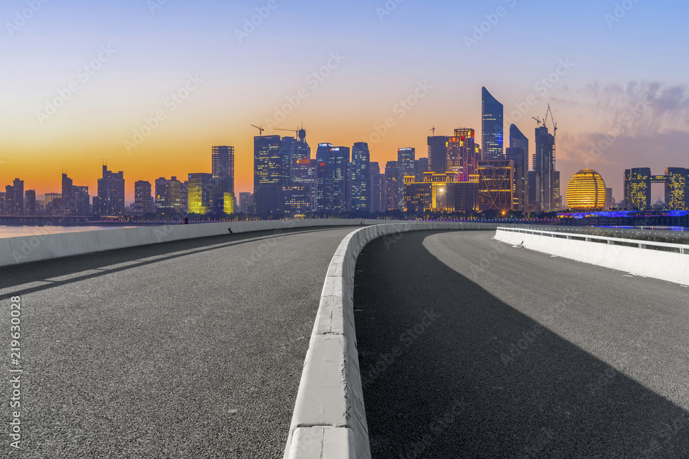 Fototapeta premium Urban road asphalt pavement and skyline of Hangzhou architectural landscape