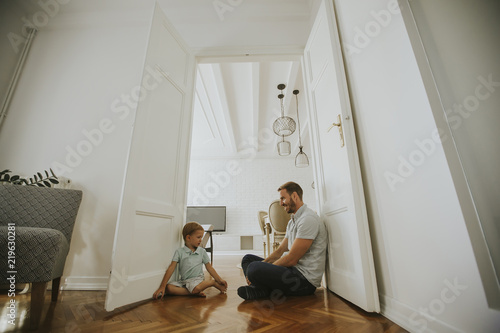 Happy father with his son playing at home