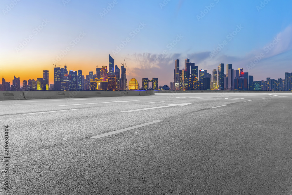 Urban road asphalt pavement and skyline of Hangzhou architectural landscape