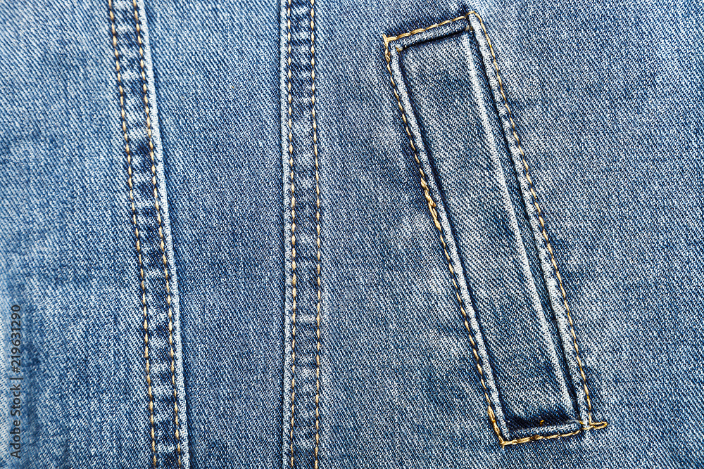 pocket on denim jacket close-up, blue jeans pocket on denim jacket close-up, blue jeans