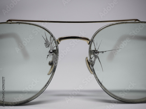 Old fashion glasses have a lens cracked 