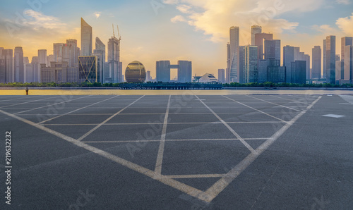 Urban road asphalt pavement and skyline of Hangzhou architectural landscape