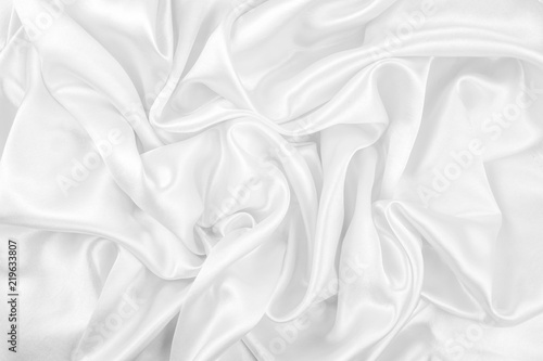 Luxurious of smooth white silk or satin fabric texture background