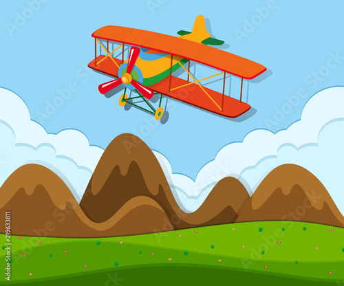 An airplane flying above the ground
