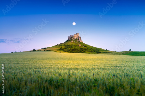 Ruin of Spissky Castle in Slovakia at sunset photo