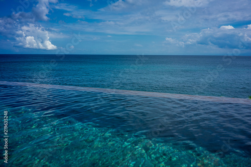 infinity pool with blue ocean background