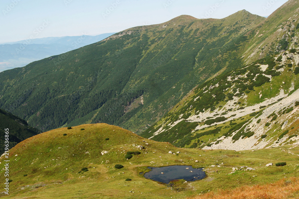 Beautiful mountain panorama from Western Tatras with small tarn.  Mountain lake. 