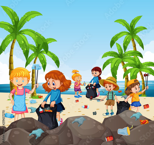 Volunteer children collecting trash at the beach