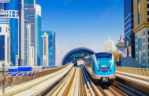 City Metro Train in Sunlight on the Outdoor Railway photo