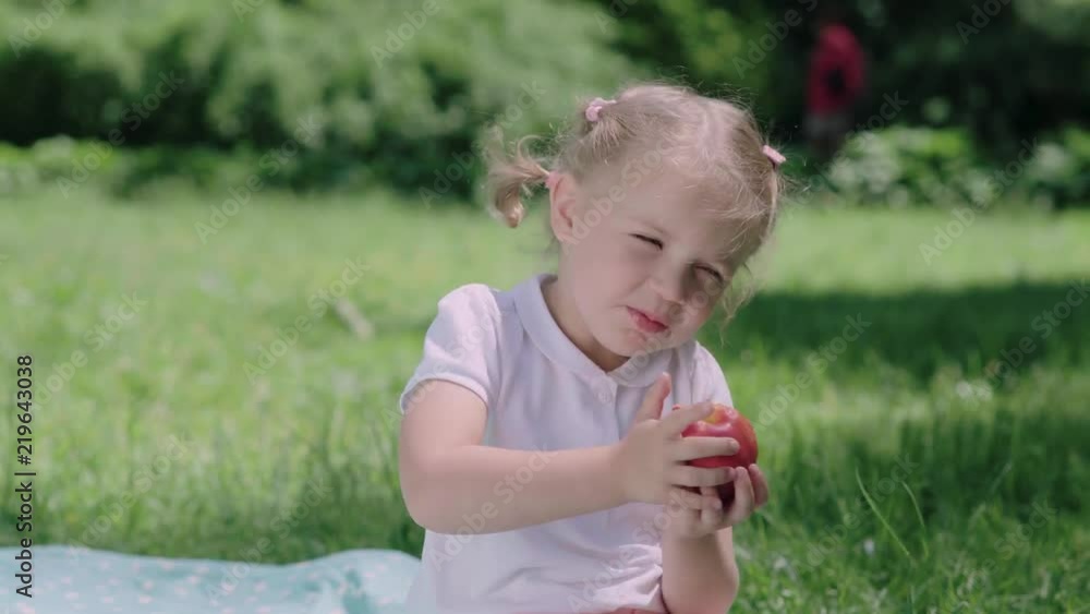 Healthy Nutrition. Child Eating Juicy Apple Outdoors Healthy Nutrition. Child Eating Juicy Apple Outdoors
