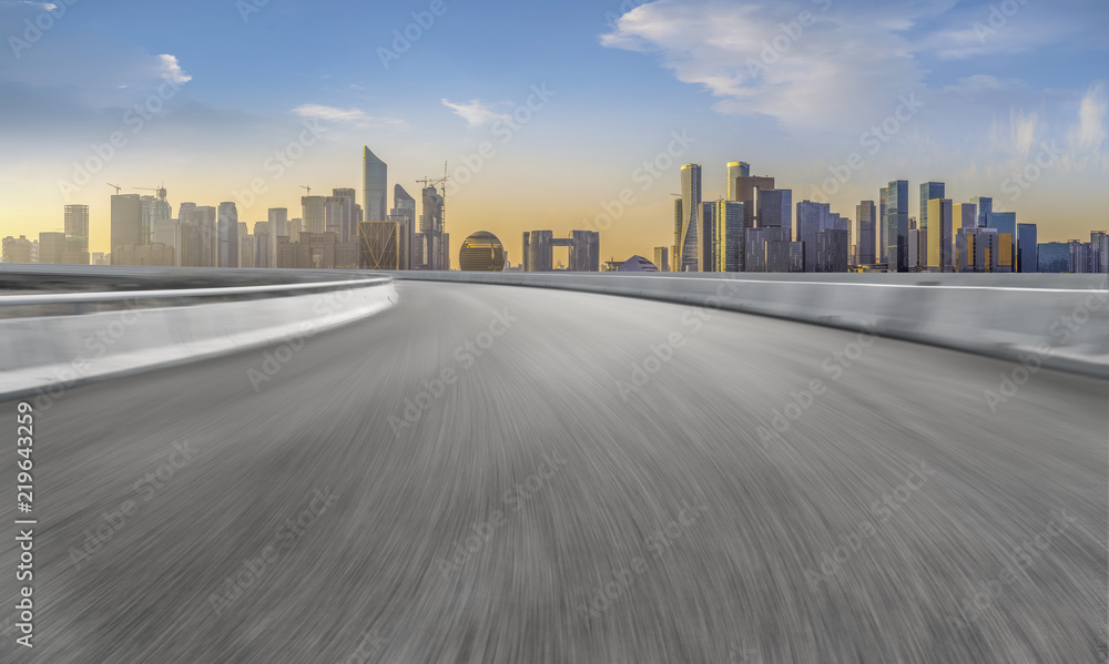 Obraz premium Urban road asphalt pavement and skyline of Hangzhou architectural landscape